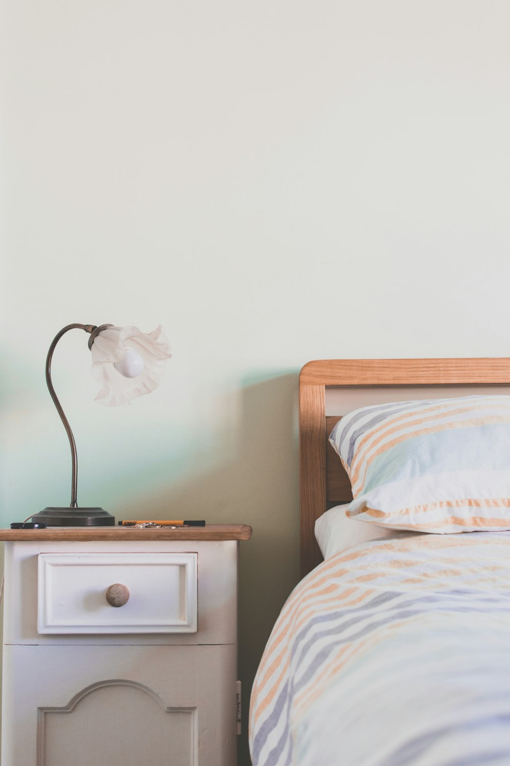 table lamp on top of nightstand