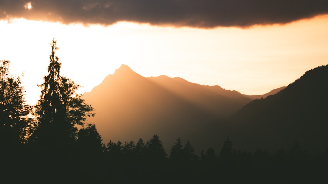 silhouette photography of mountain during golden hour
