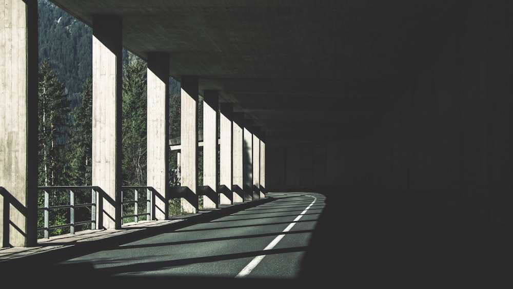 a view of a street from under a bridge