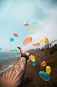 person throwing balloons