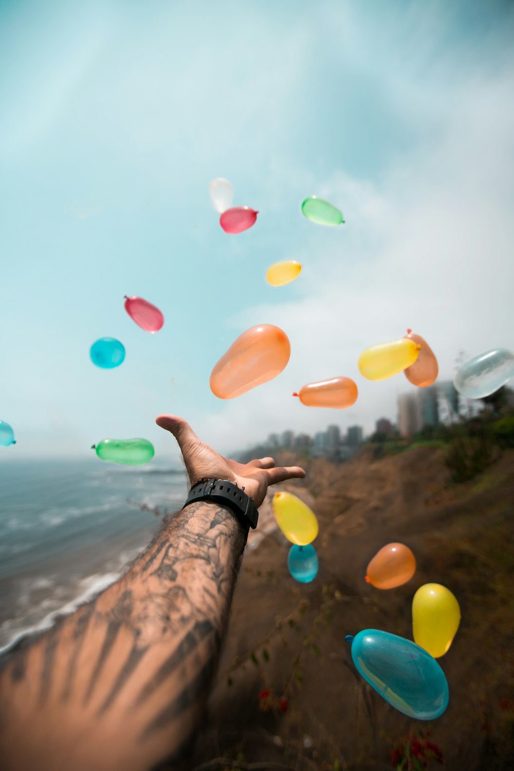 person throwing balloons