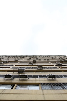 beige building in worm's eye view photography