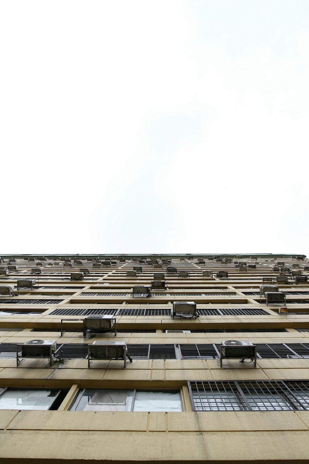 beige building in worm's eye view photography