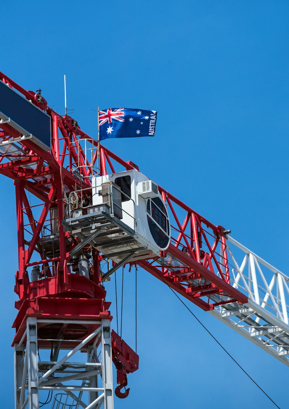 red and white metal crane