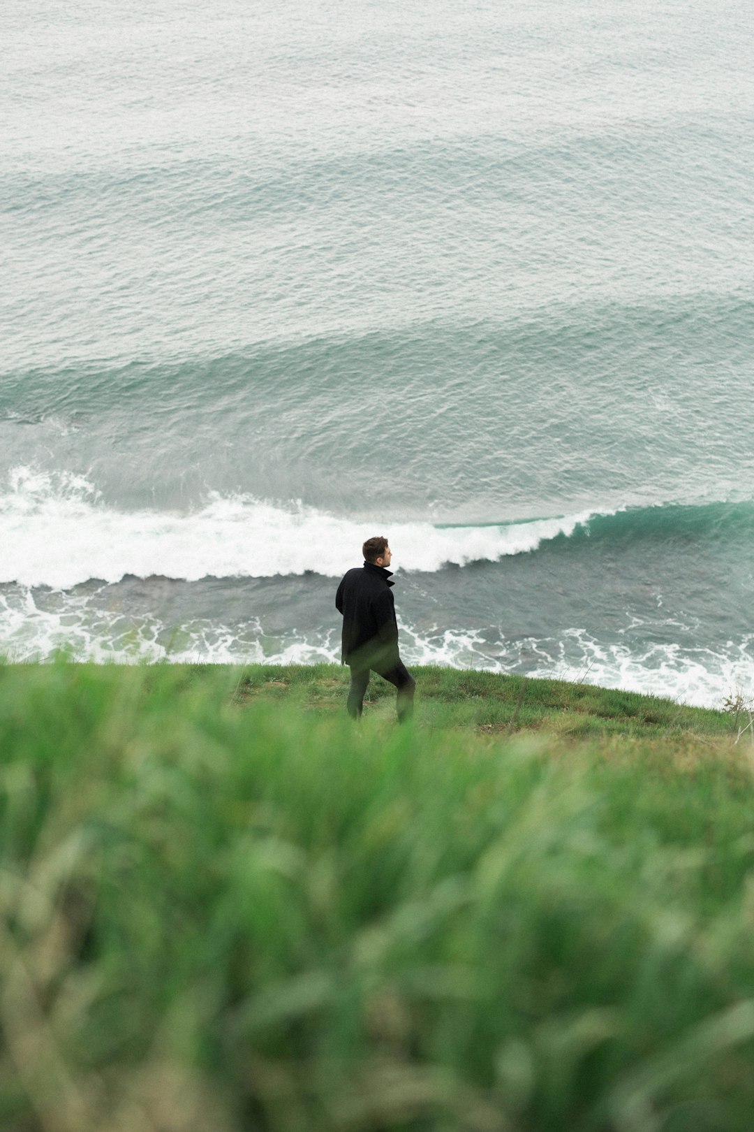person standing on sea shore