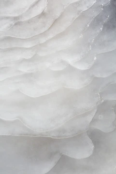 Abstract translucent layers representing sterile filtration with particles being blocked by membrane barriers.