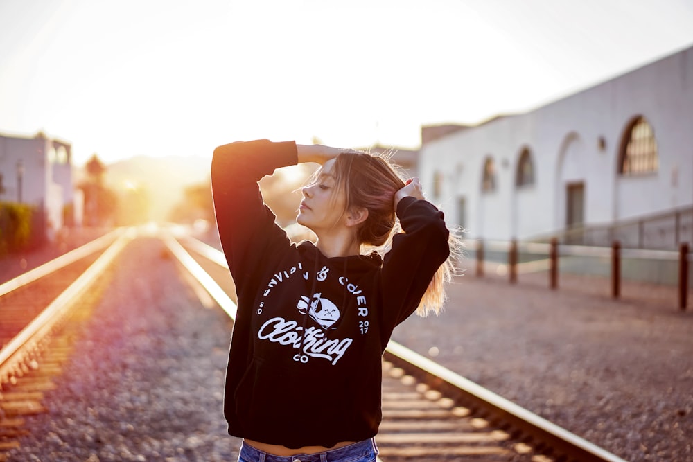 woman between railroads