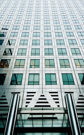high-rise gray concrete building during daytime