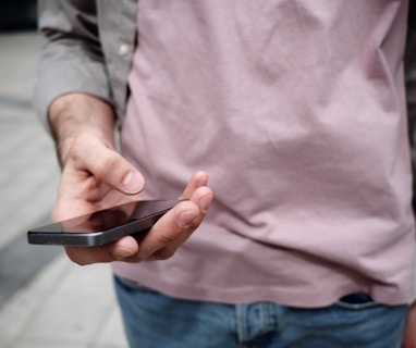 person holding phone while holding