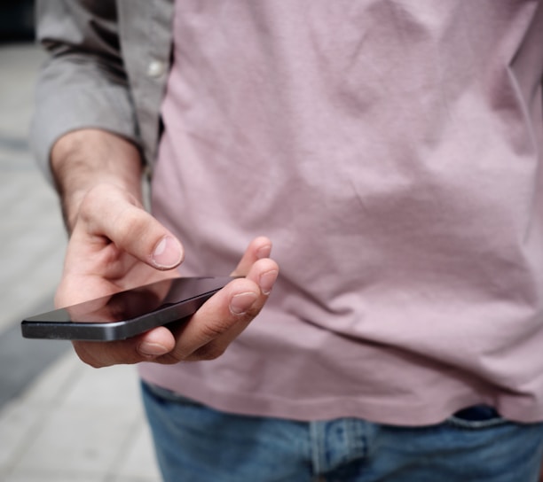 person holding phone while holding