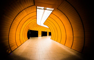 Interior shot of a modern tunnel with smooth curves and bright lighting