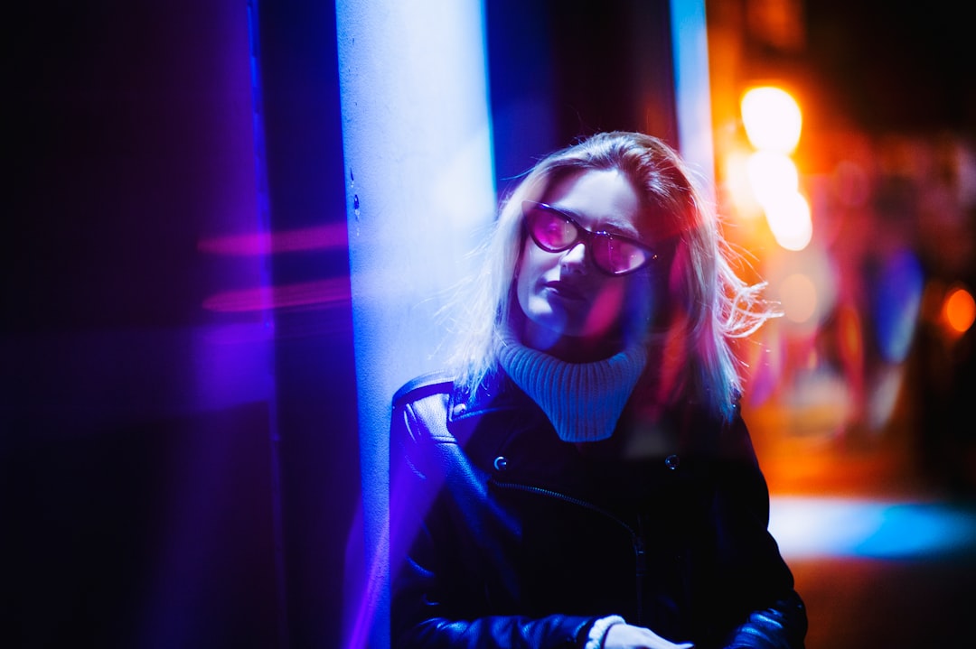 woman wearing sunglasses low light photography