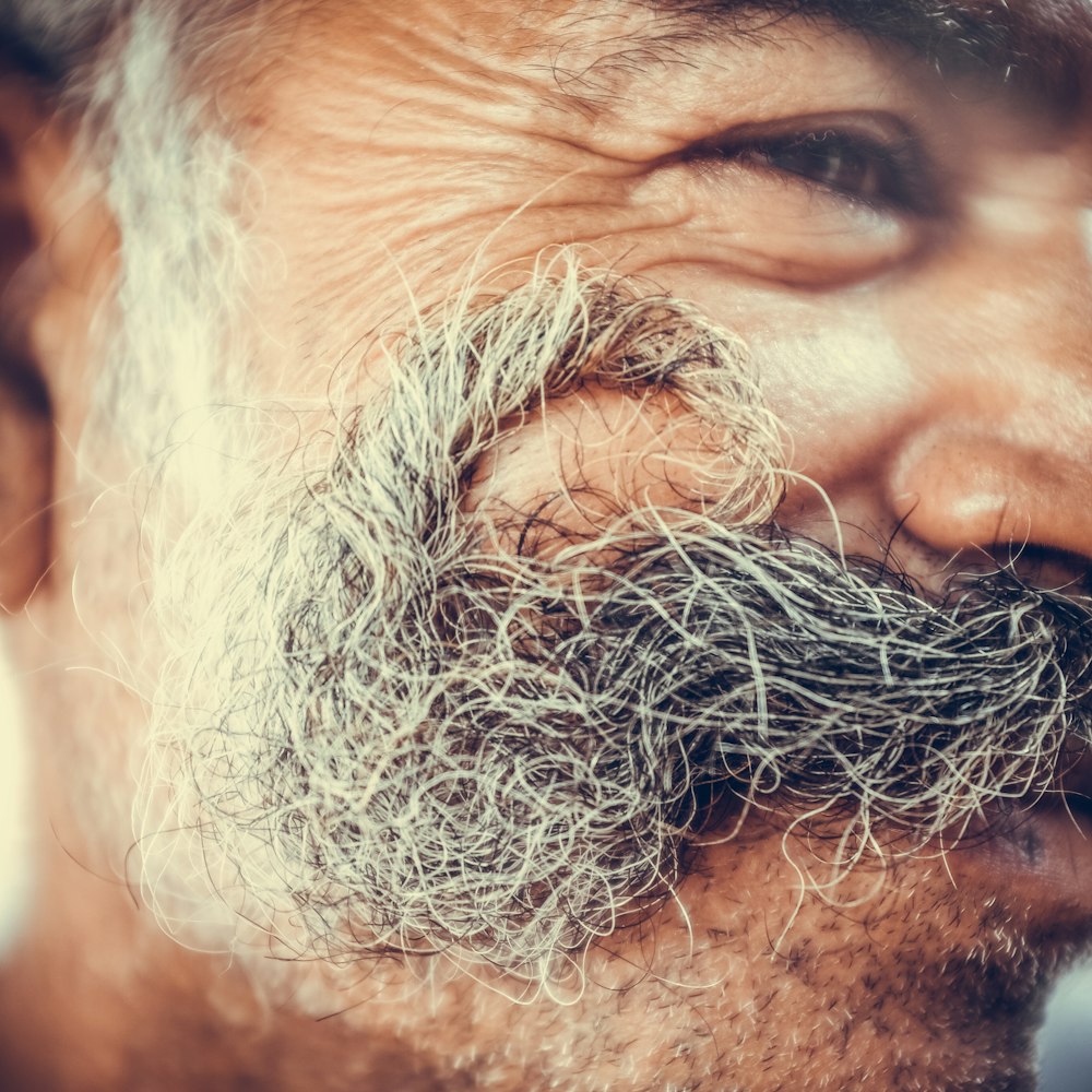 close-up photo of man with mustache