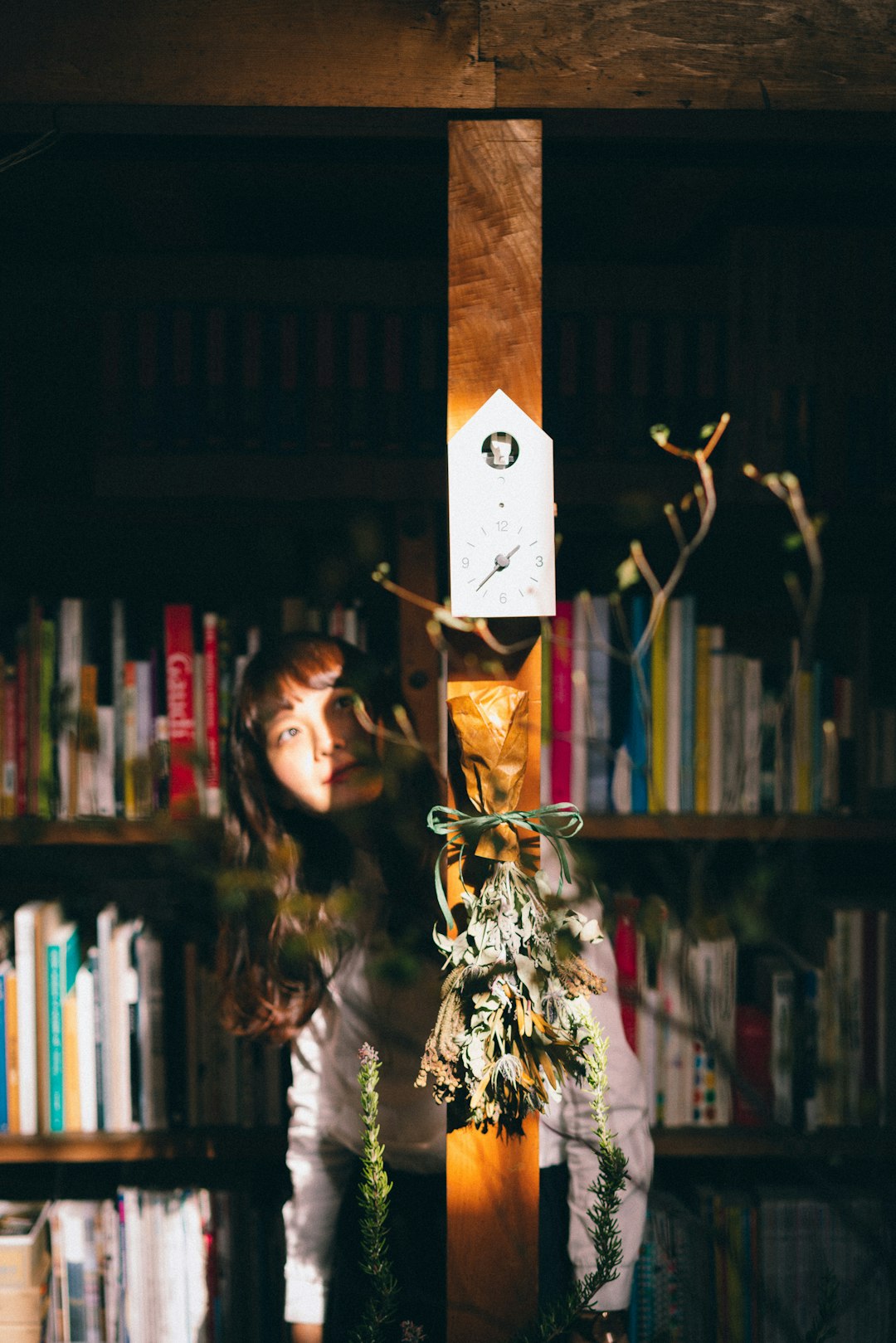 woman covering on brown wooden post