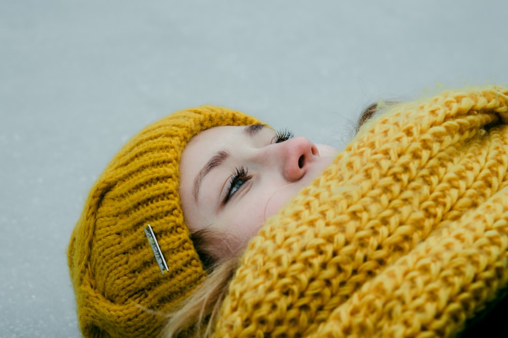 person in yellow knit hat