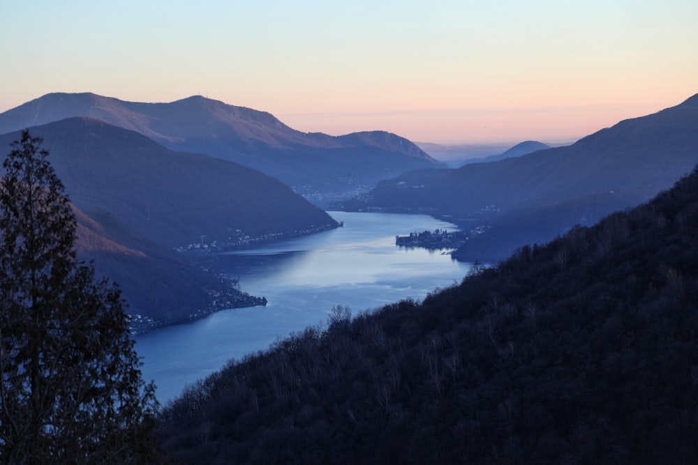 high-angle photography of river at base of mountain