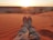 person sitting on sand