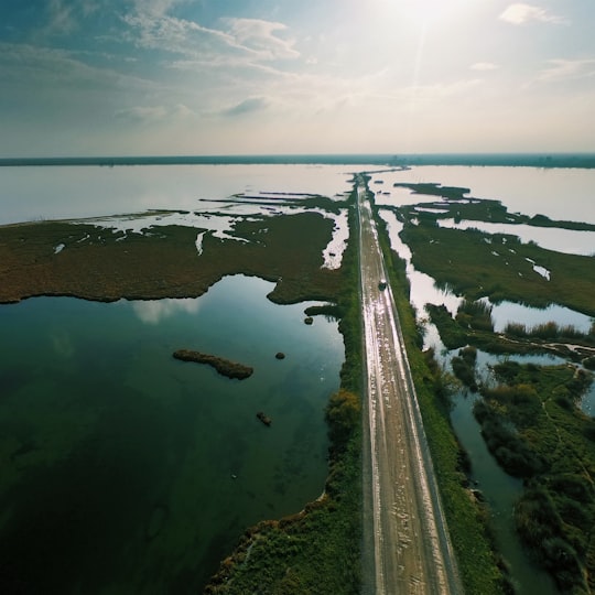 aerial photography of asphalt road in between body of water in Chalastra Greece