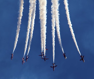 low angle photography of plane contrail