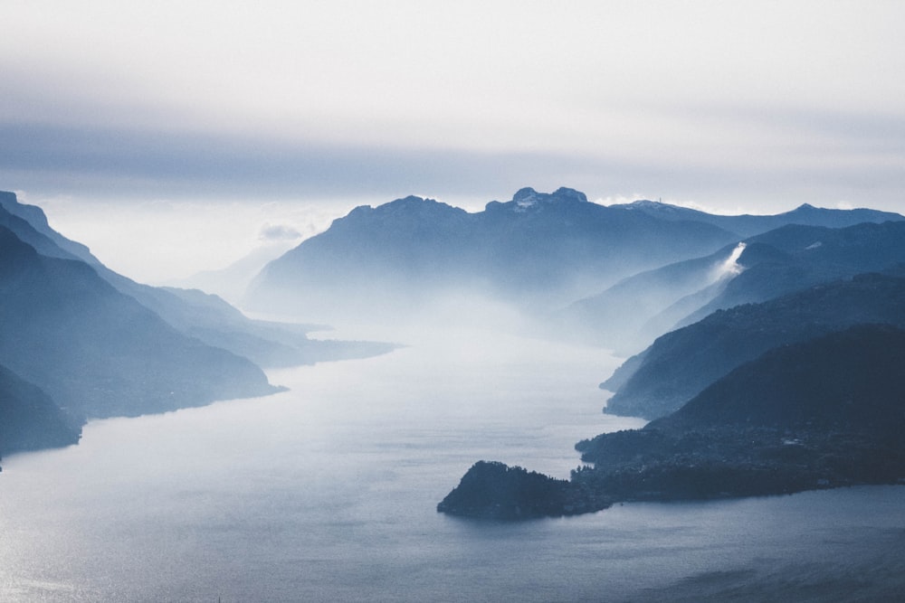 bird's eye view photograph of mountains and lake