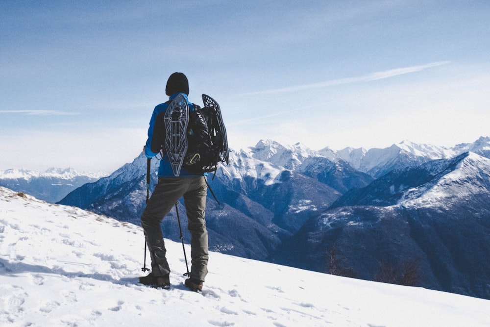 man walking on snow mountain