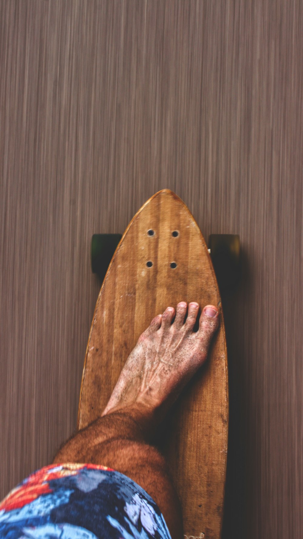 man on brown skateboard