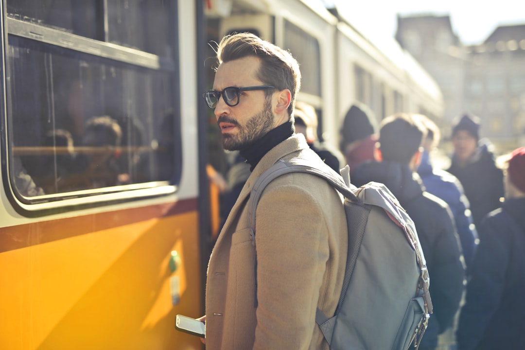 tilt-shift photography of man, tram