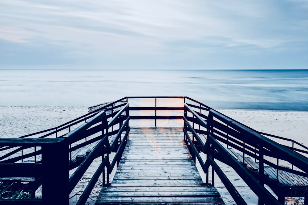 sea dock under cloudy sky