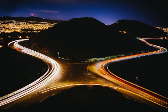 aerial view photography of cross road near mountain during nighttime in Twin Peaks United States