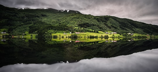 green covered mountain in panorama photography in Flam Norway