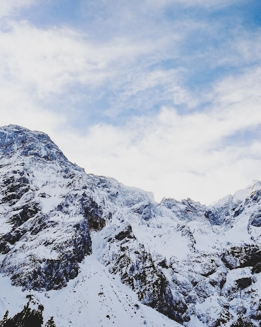 permafrost mountains under partially cloudy skies in Zgornje Jezersko Slovenia