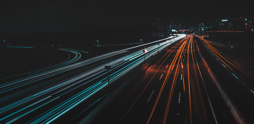 time lapse photography of lighted road at night