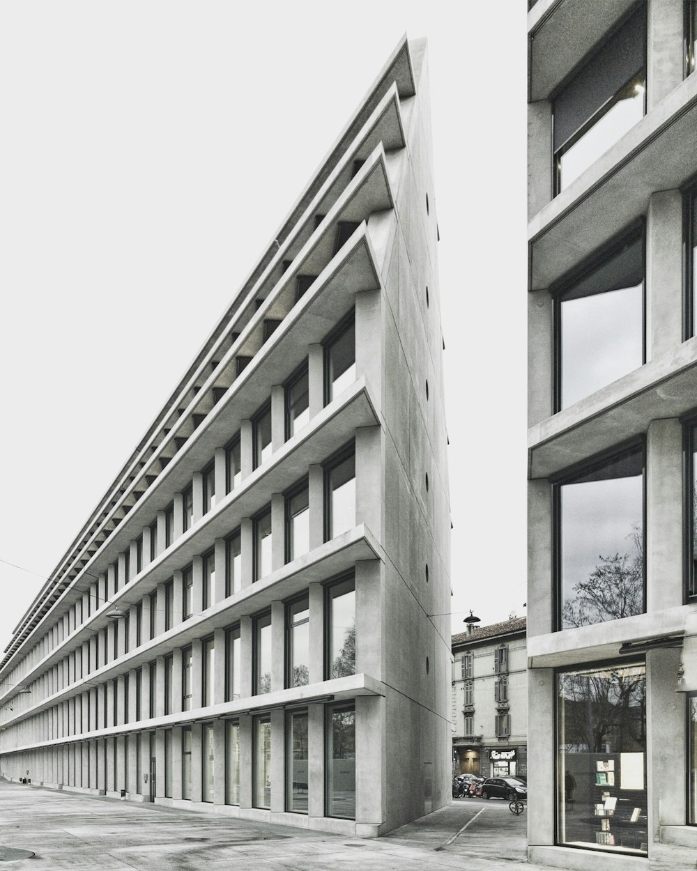 gray concrete high-rise building over cloudy sky at daytime