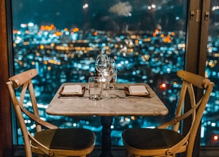 white ceramic table and chairs with glassware