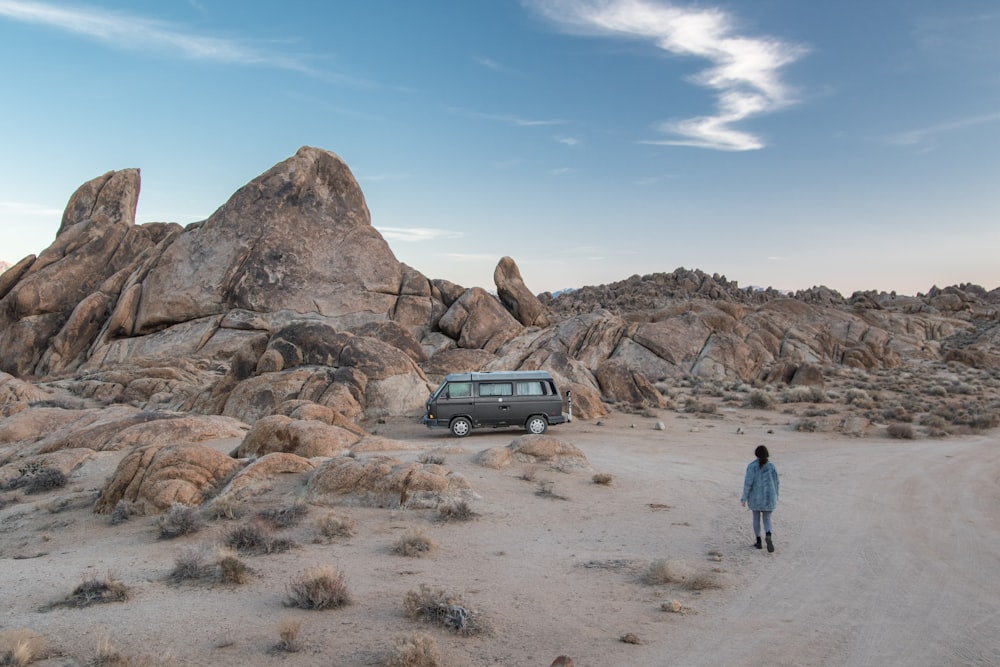 person walking on desert