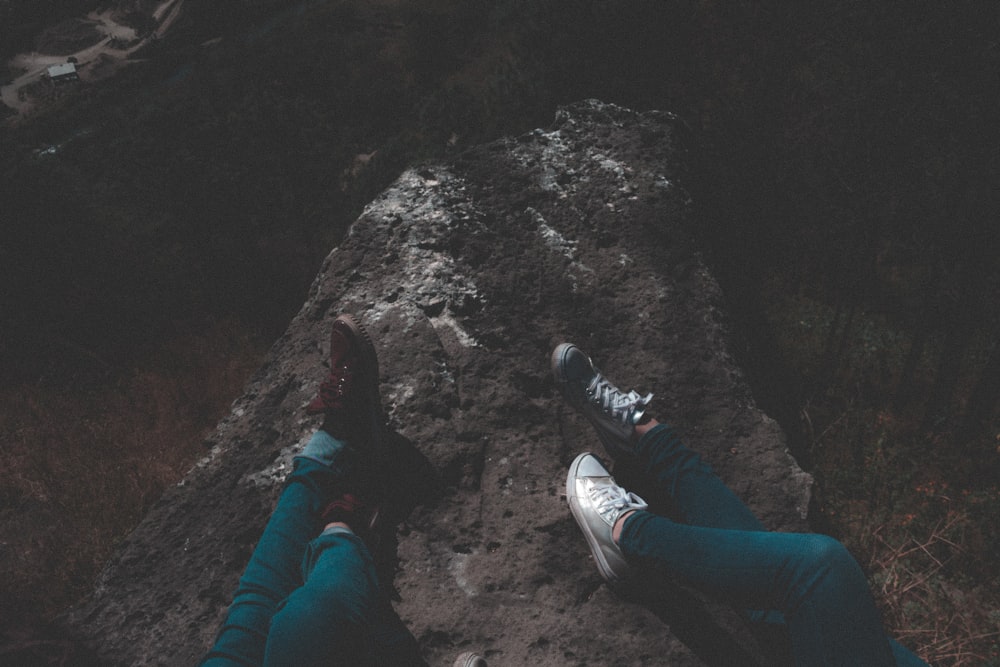 person laying on rock