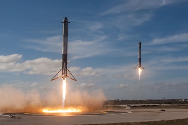 balance and symmetry for photo composition,how to photograph spacex falcon heavy landing; twom white flying rockets during daytime