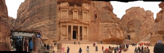 A vibrant market scene in Petra with ancient rock-cut architecture in the background.
