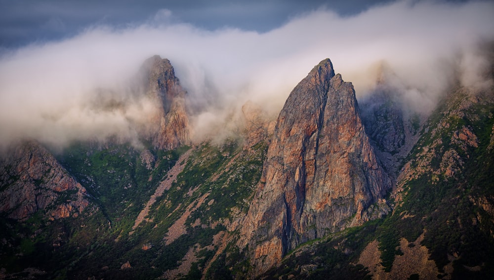 sea of clouds surrounding mountains