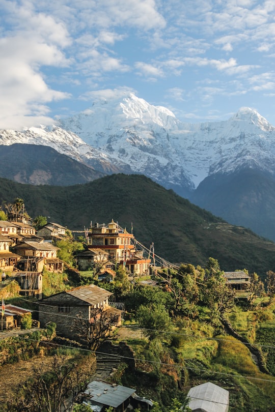 houses overlooking mountain range in Annapurna Conservation Area Nepal