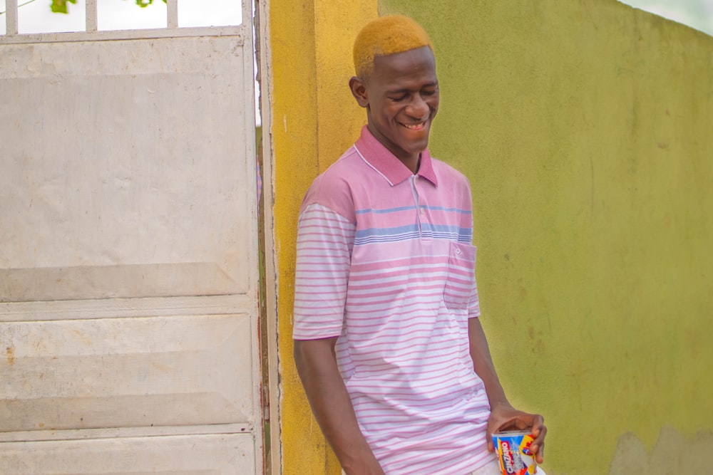 man leaning against wall