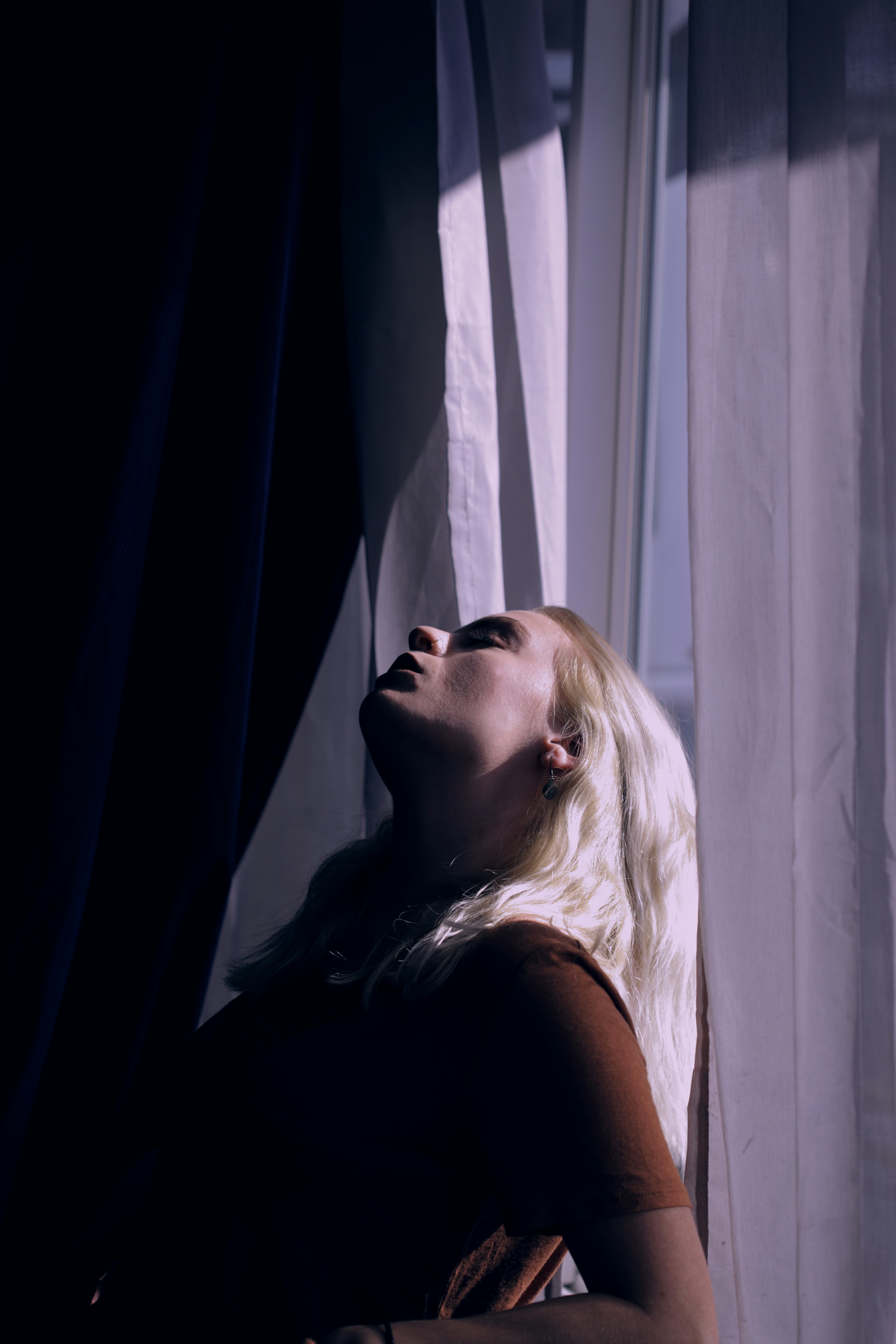 woman leaning on window