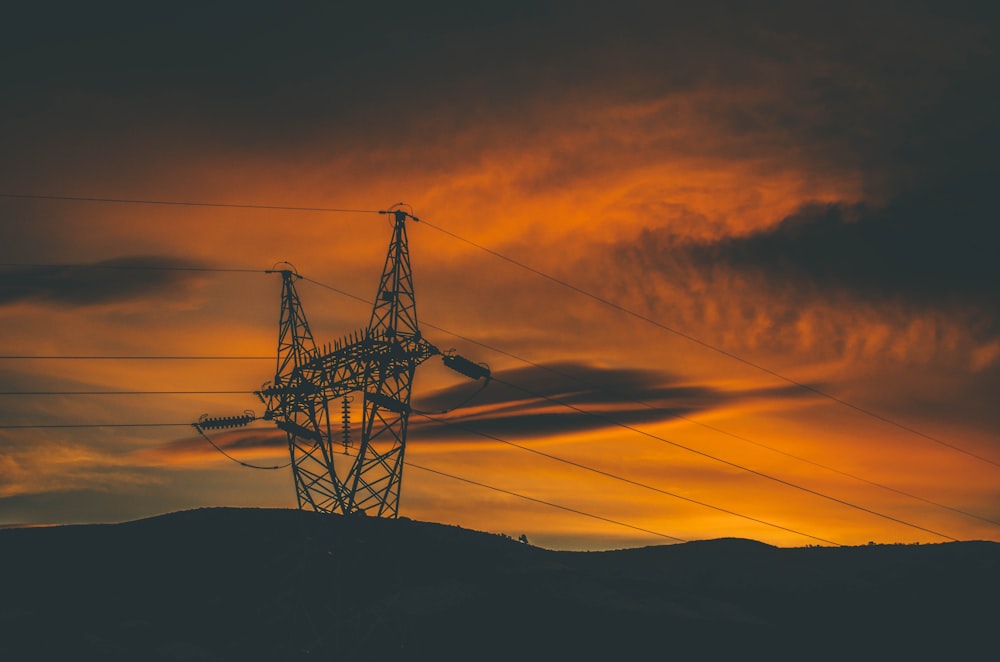 silhouette photo of tower during golden hour