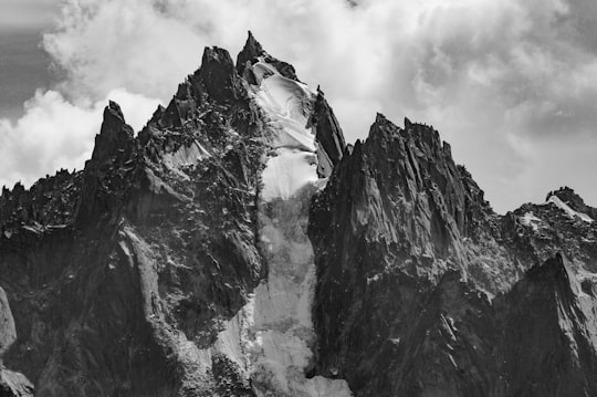 rock formation under clouds in Aiguille du Grépon France