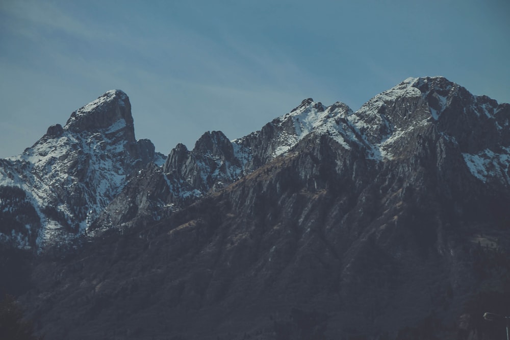 low angle photography of snow-covered mountain