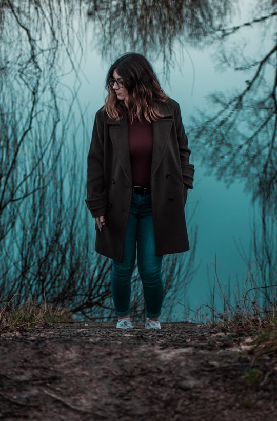 woman walking near withered plants in Auvergne-Rhône-Alpes France