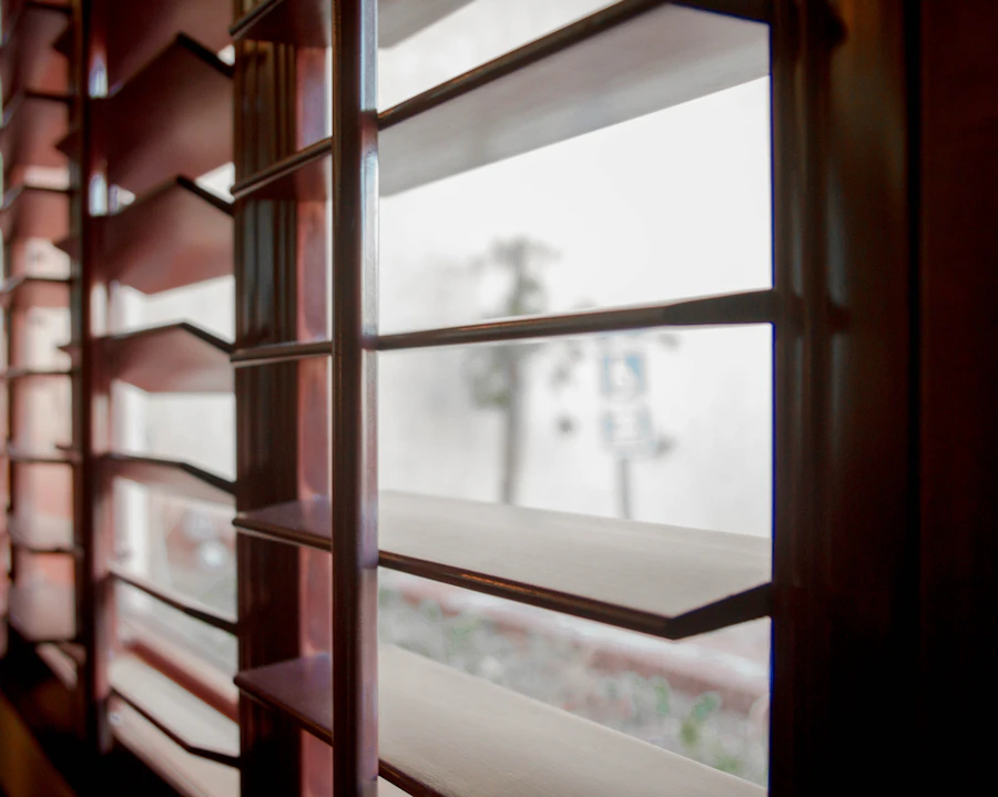 Close-up of an open timber plantation shutter louvre