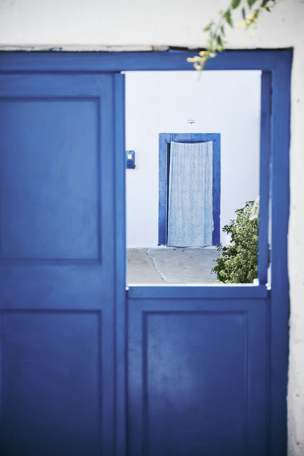 selective focus photography of door room with curtain