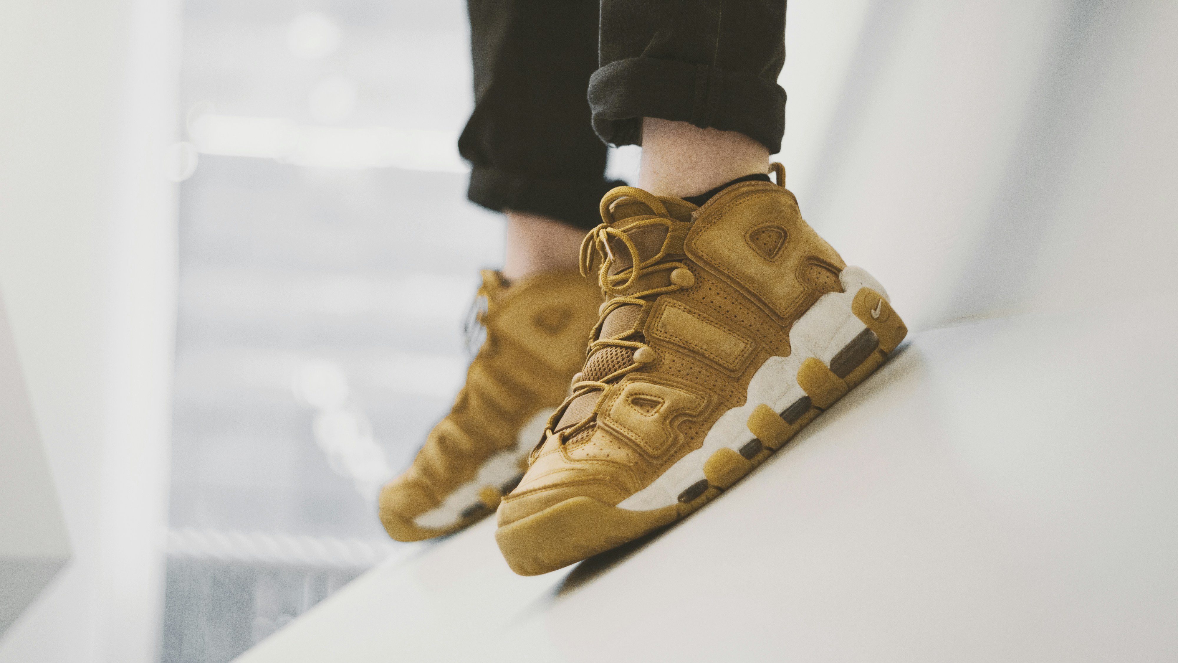 woman wearing yellow long-sleeved dress under white clouds and blue sky during daytime