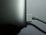 A close-up of a laptop battery being installed.